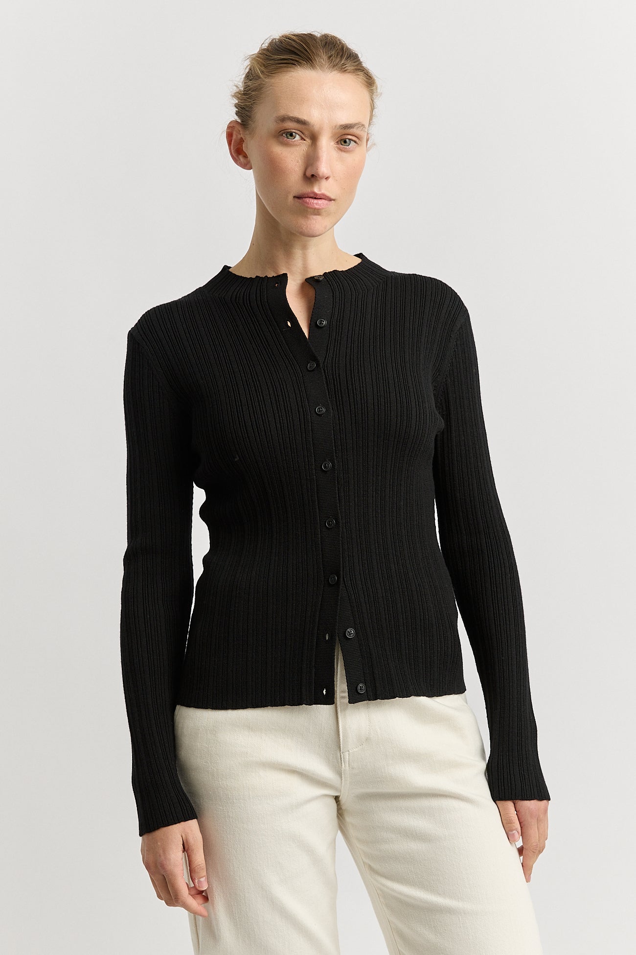 Our model is wearing a size 8. Garment Length for size 8 is 56.5 cm. Add 1cm for each size.